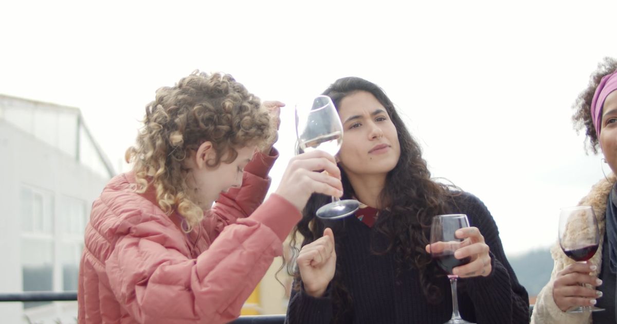 Friends spending an evening together on a rooftop